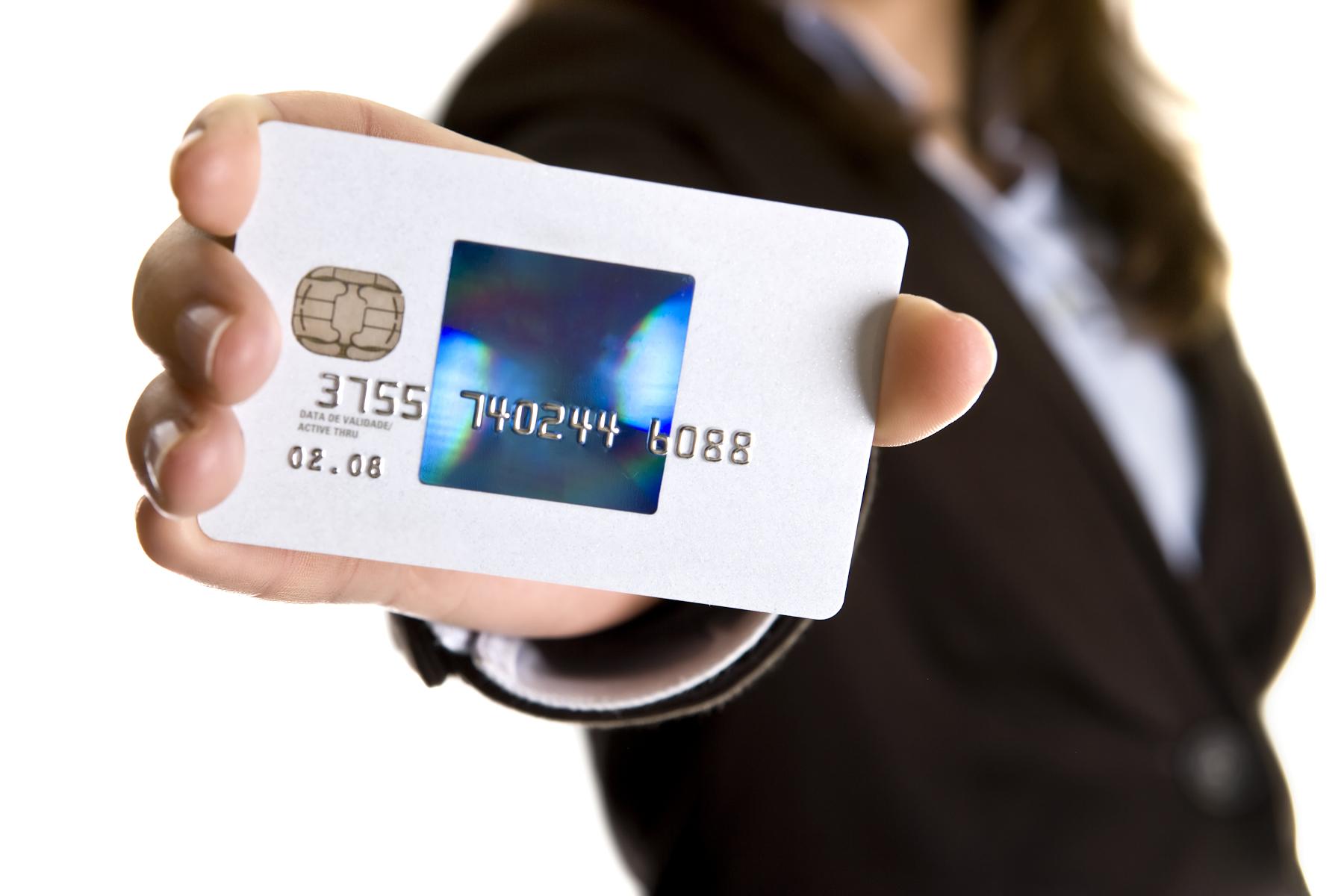 business credit card being held in hand