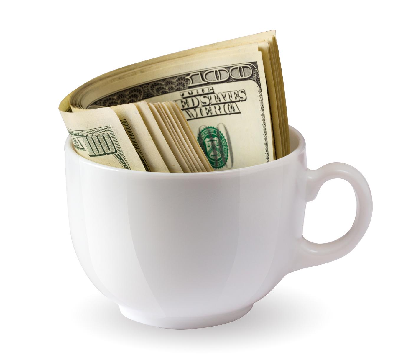 hundred dollar bills in a teacup