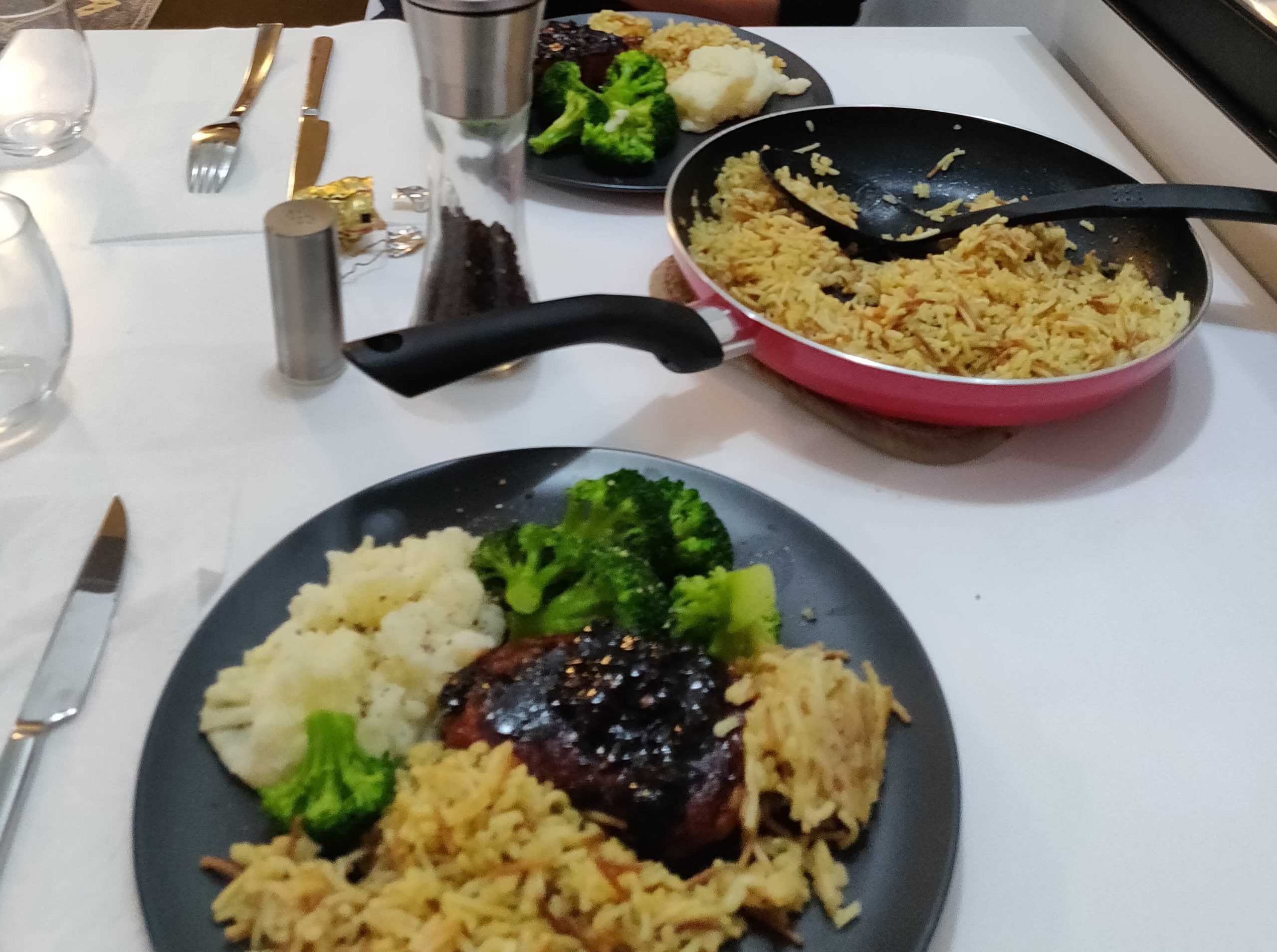 fresh cooked pork chop and rice on the table