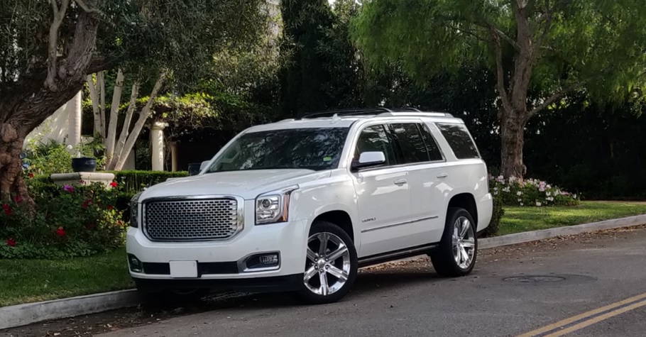 White SUV Under Trees