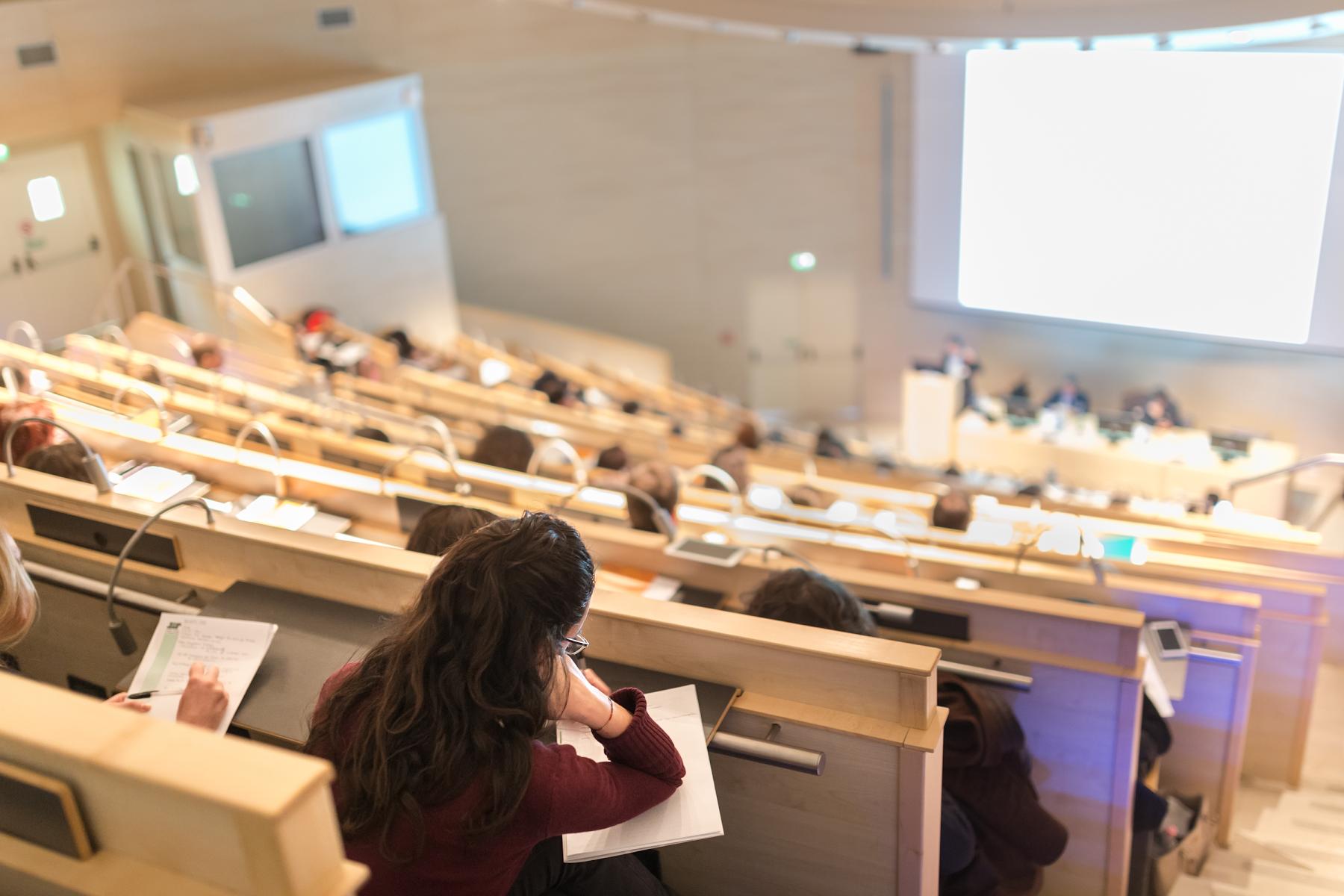 students sitting at a lecture in college