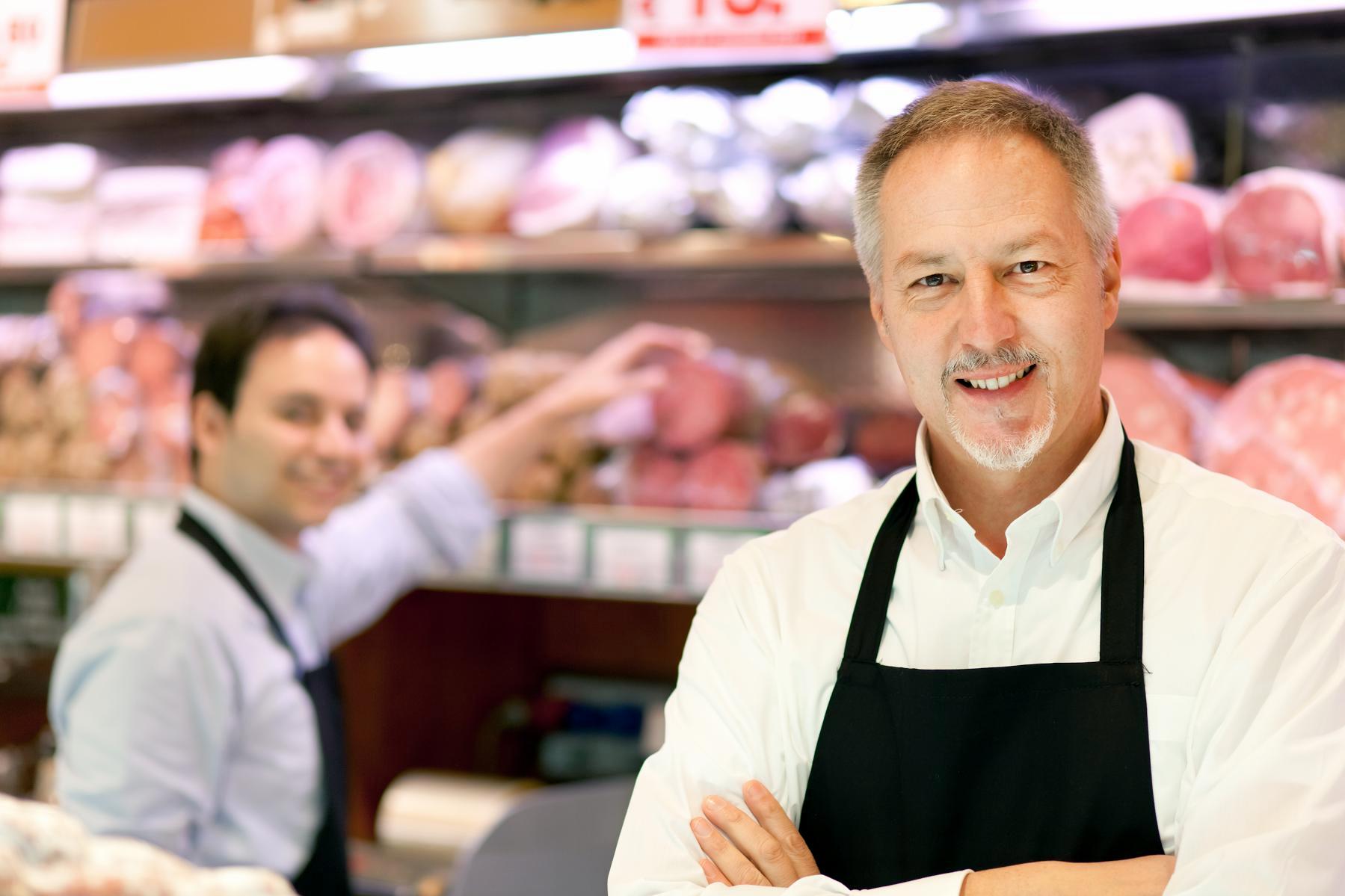 grocery store workers smiling