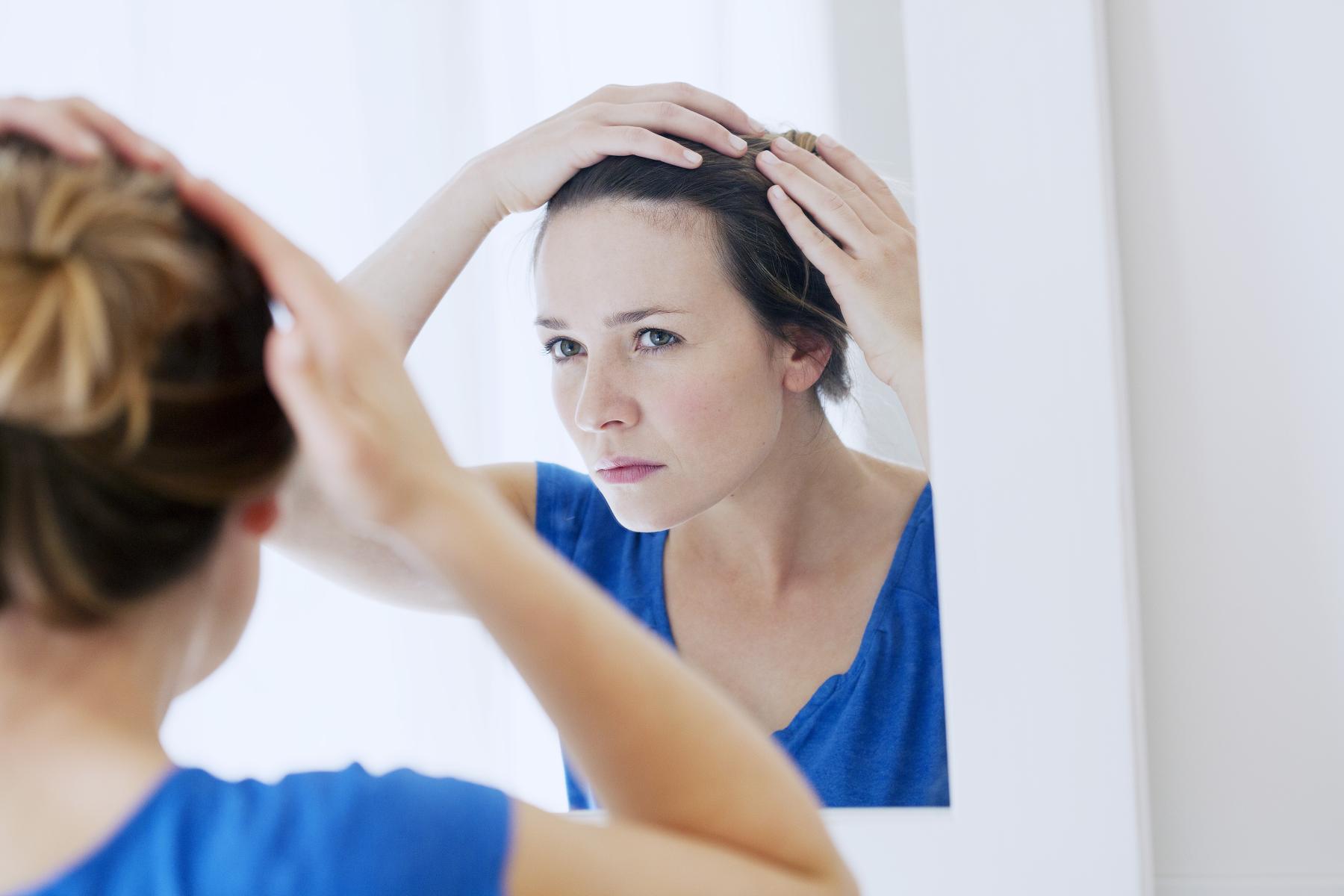woman looking at scalp